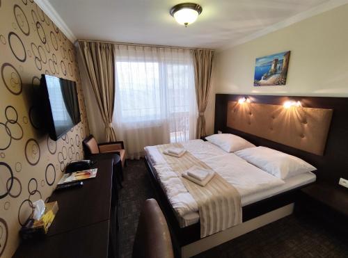 Postel nebo postele na pokoji v ubytování Hotel Sun