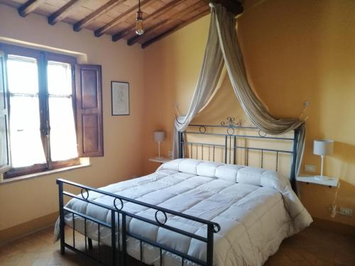 Postel nebo postele na pokoji v ubytování Podere Sant'Antonio