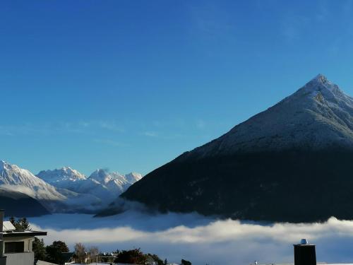 a view of a mountain with clouds in front of it at #HeimatLiebe in Imst