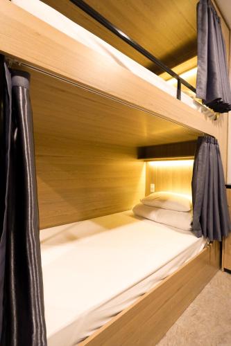 Cama o camas de una habitación en MOTOGO Hostel