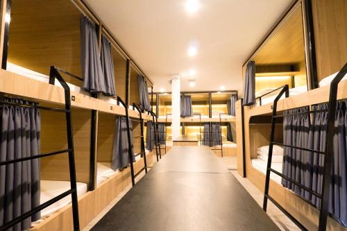 a row of bunk beds in a dorm room at MOTOGO Hostel in Sóc Sơn