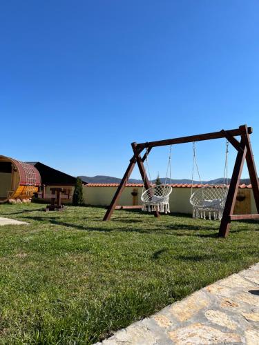a swing set in the yard of a house at Vila Impresija, Fruška gora in Novi Sad