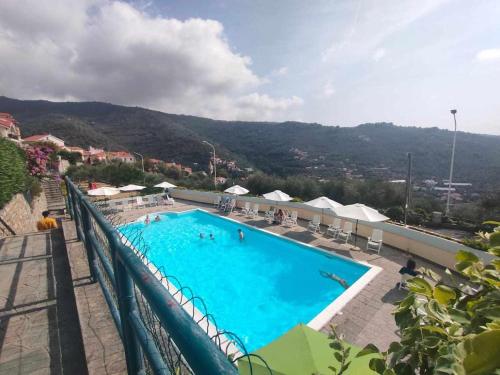 a large swimming pool on top of a building at Casa Ulivo con Piscina in Diano Castello