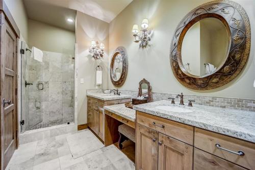 a bathroom with two sinks and a shower at Mont Cervin 32 by AvantStay Ski In Ski Out Home in Silver Lake Village w Hot Tub in Park City