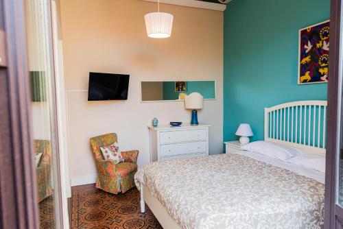 En eller flere senge i et værelse på Le Grazie