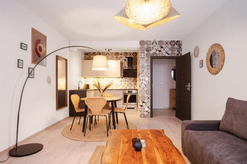 a living room with a couch and a table at Boutique Apartment 23 in Jáchymov