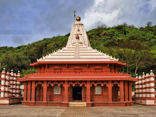 a large building with a tower on top of it at B-5 Sea Vista Apartment Dream Home in Ratnagiri
