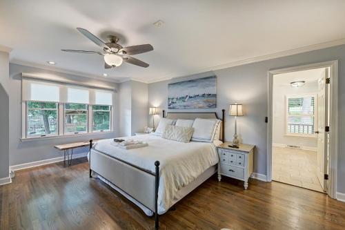 a bedroom with a bed and a ceiling fan at A Frame of Mind by AvantStay Private Dock View in Lake Norman of Catawba