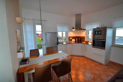 Η κουζίνα ή μικρή κουζίνα στο Appartement Caldera