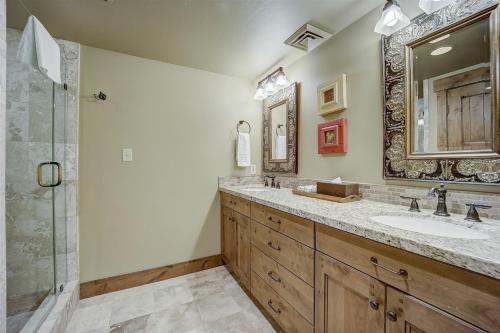 a bathroom with a double sink and a shower at Mont Cervin 33 by AvantStay Luxury Ski in Ski out home in Park City in Park City