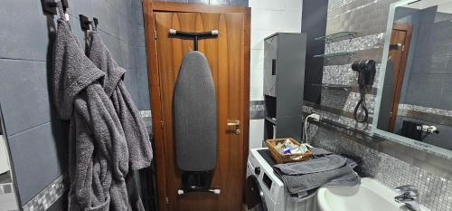 a bathroom with a sink and a mirror and a shower at Milan Condo ideal for Families,Pets,Business in Milan