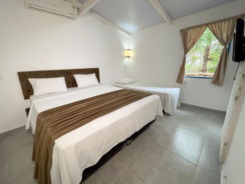 Katil atau katil-katil dalam bilik di Ranchos 30 Hotel Fazenda