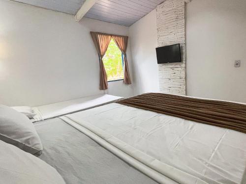 Katil atau katil-katil dalam bilik di Ranchos 30 Hotel Fazenda