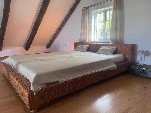 a large bed in a room with a window at Lucky Lemons - Boutique Houses Madeira - 2 in Estreito da Calheta