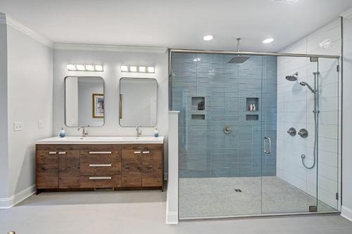 a bathroom with a glass shower and a sink at Bright Water Cove by AvantStay Saltwater Pool in Denver