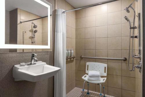 a bathroom with a sink and a shower with a toilet at La Quinta by Wyndham Mt. Laurel - Philadelphia in Mount Laurel