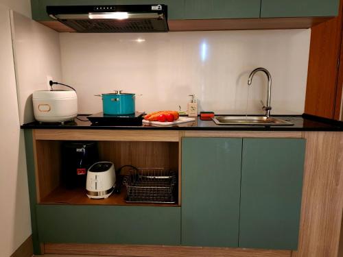 a kitchen with a counter top with a sink and a counter top at Mi Amor Luxury Island Apartment - 3 minutes to the beach in Phu Quoc