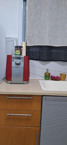 a kitchen with a counter top with a appliance on it at RutSuite in El ‘Affūle