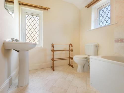 a bathroom with a sink and a toilet and a tub at 3 bed property in Pardshaw Lake District SZ419 in Dean