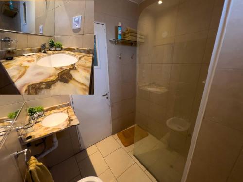 a bathroom with two sinks and a shower at Rent for Days - Microcentro in San Miguel de Tucumán