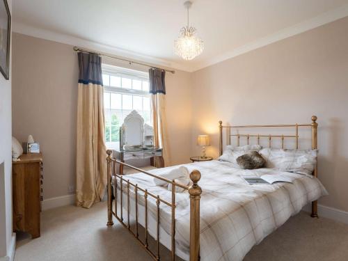 a bedroom with a bed and a window at 4 Bed in Pevensey 85305 in Pevensey