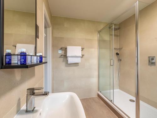 a bathroom with a sink and a shower at 2 Bed in St. Mellion 87715 in St Mellion