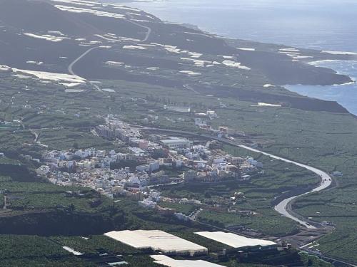 an aerial view of a town next to the ocean at Casa Las Tías Tazacorte in Tazacorte