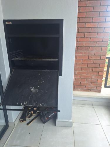 a fire inside of an oven in a house at Coastal Retreats in Ballito