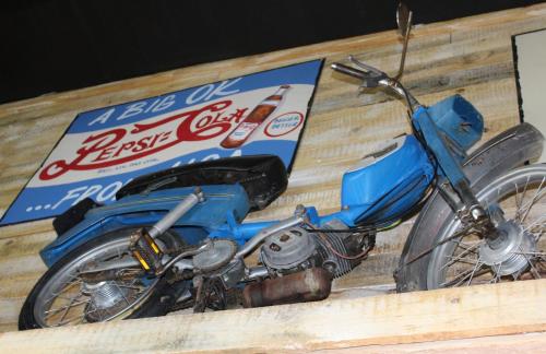 a blue motorcycle parked next to a box at Barrydale Karoo - BOUTIQUE HOTEL in Barrydale