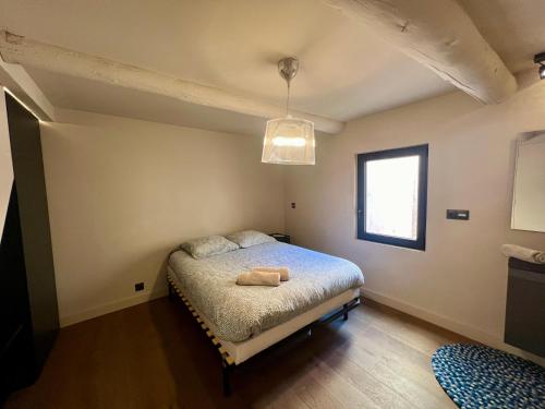 Posteľ alebo postele v izbe v ubytovaní Appartement 100M2 dernier étage - chambre atypique