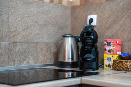 a coffee maker sitting on top of a kitchen counter at White House NS in Novi Sad