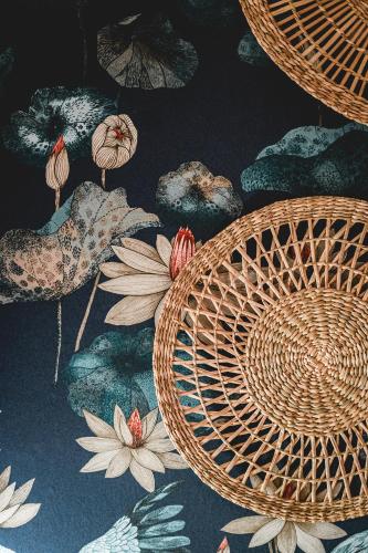a pattern of wicker baskets and flowers on a wall at Artists' Nest in Marsaskala