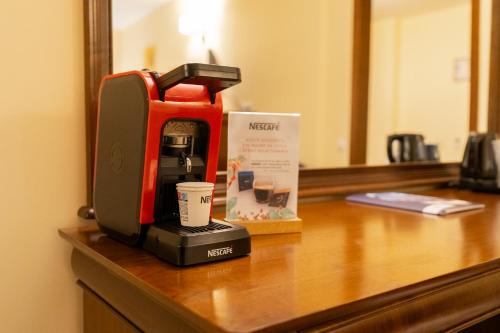a coffee maker sitting on top of a counter at Hotel Dorna in Vatra Dornei