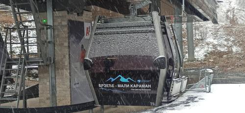 a truck with a sign on the back of it at Apartman Nina, Kopaonik, Brzeće, Kod Gondole in Brzeće