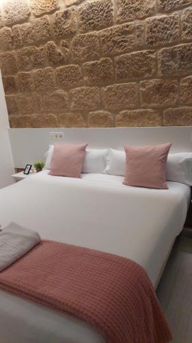 Ένα ή περισσότερα κρεβάτια σε δωμάτιο στο Hotel Norte