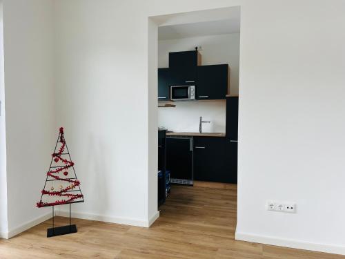 a kitchen with a christmas tree in the middle of a room at The View Apartment in Garmisch-Partenkirchen