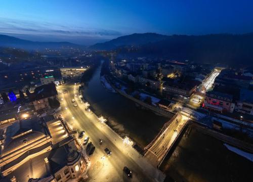 an aerial view of a city at night at Hotel Dorna in Vatra Dornei