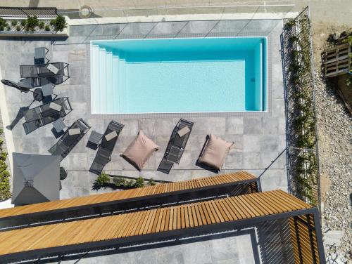 an overhead view of a swimming pool on a building at Köfele Lodge Rosa in Parcines