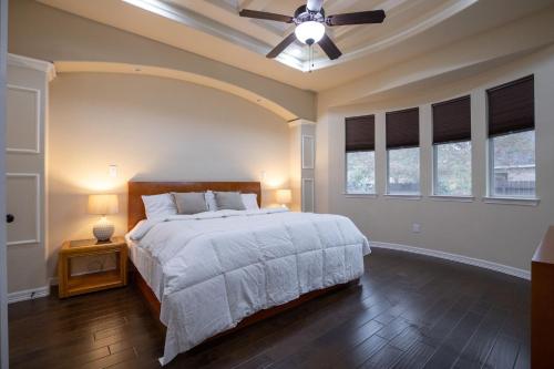 a bedroom with a bed and a ceiling fan at Randolph Central Location, 1-story, Chef Kitchen, Creekside in Selma