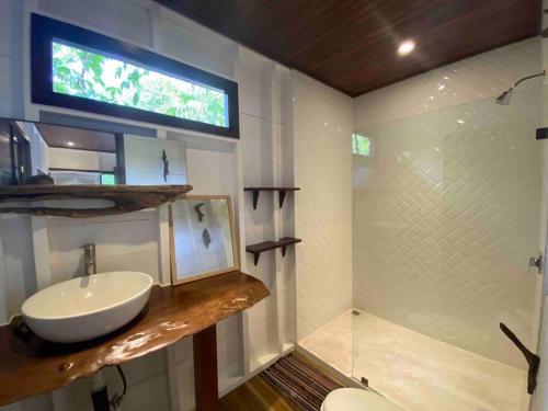 a bathroom with a sink and a shower at NEW Jungle Casita- Steps away from Punta Uva in Punta Uva