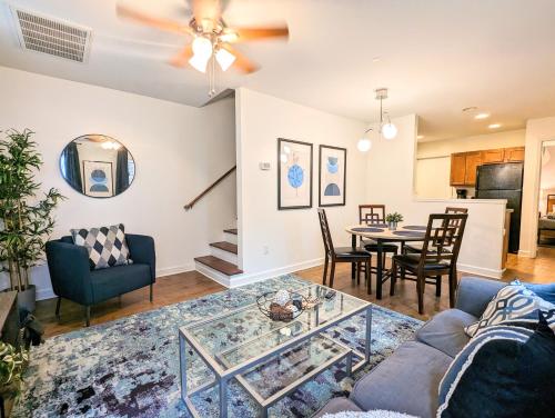 a living room with a couch and a table at League Flats West End in Charlotte