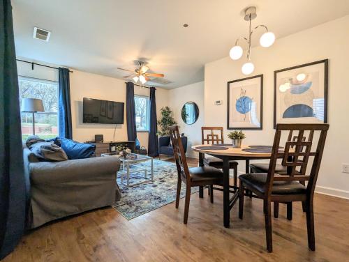 a living room with a couch and a table at League Flats West End in Charlotte