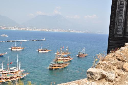 a group of boats in a large body of water at Harmony Butik Otel in Alanya