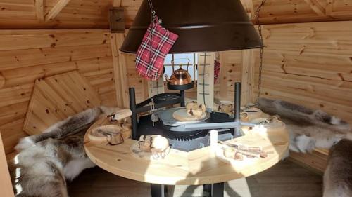 a wooden room with a table with animals on it at le chalet 