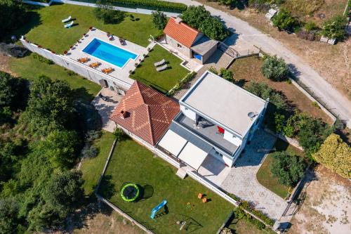 an overhead view of a house with a swimming pool at Villa Paradiso in Blato na Cetini