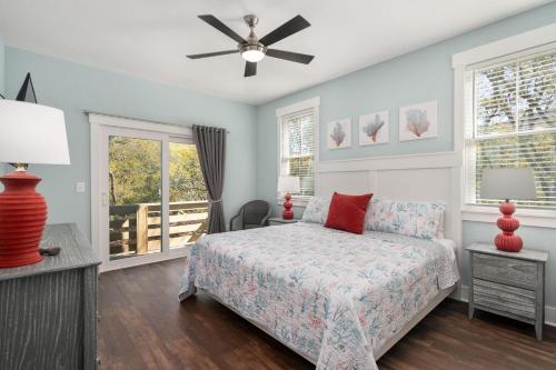 a bedroom with a bed and a ceiling fan at Sound Sea Haven in Sanderling