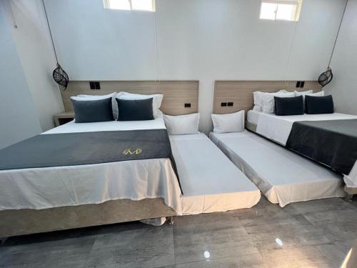 Postel nebo postele na pokoji v ubytování HOTEL MASS LUXURY