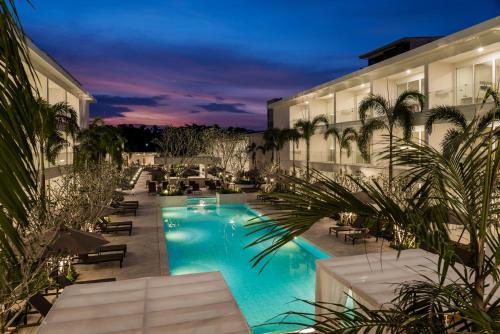 an image of a hotel pool at night at Niranapa Boutique Resort in Kata Beach