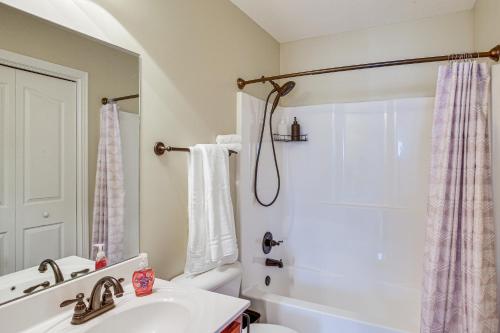 a bathroom with a sink and a toilet and a shower at Large Clarksville Family Home about 4 Mi to Speedway! in Oak Grove