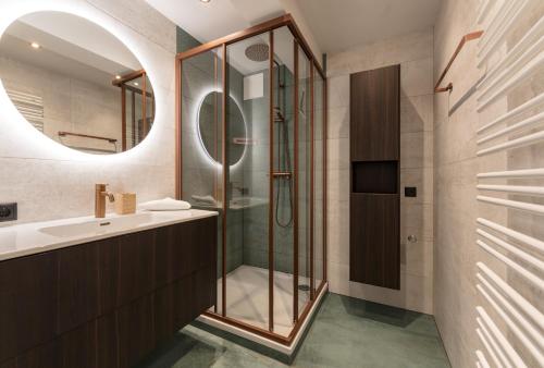 a bathroom with a shower and a sink at Villa Waluliso by Schladming-Appartements in Schladming